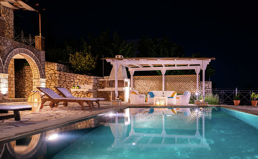 Pool and pergola glowing after dark