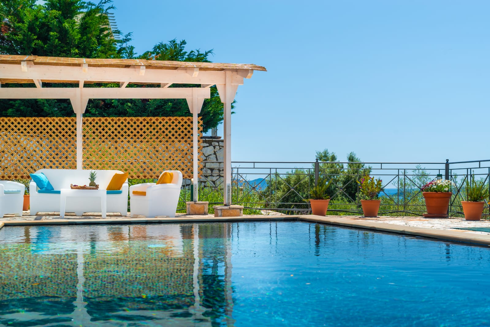 Sun-drenched pool and shaded seating