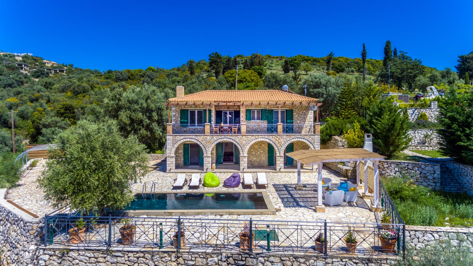 Villa Emma stone façade and pool among the olive groves